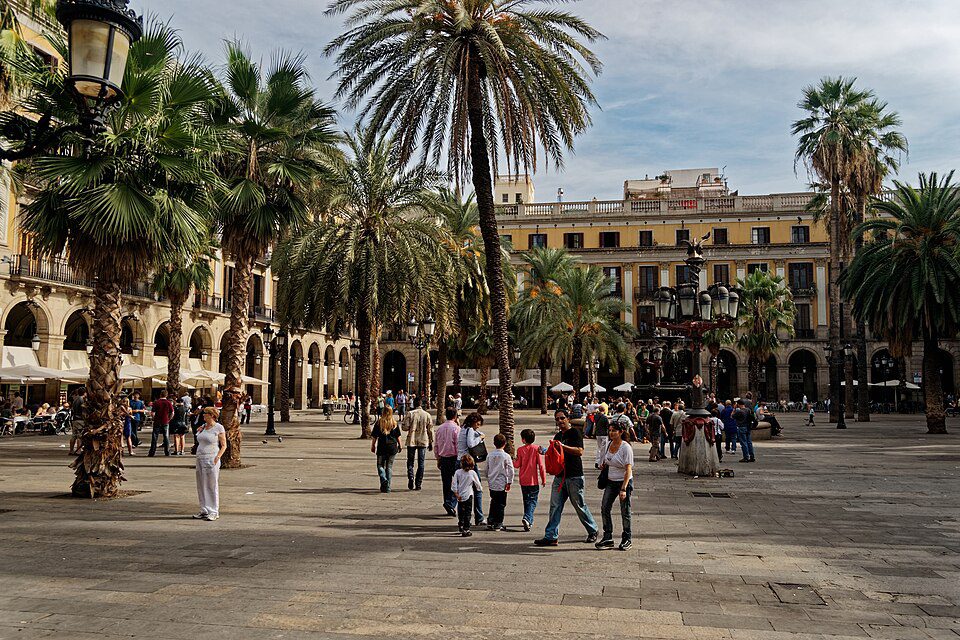 Palms and arcades around Plaça Reial in the Gothic Quarter.