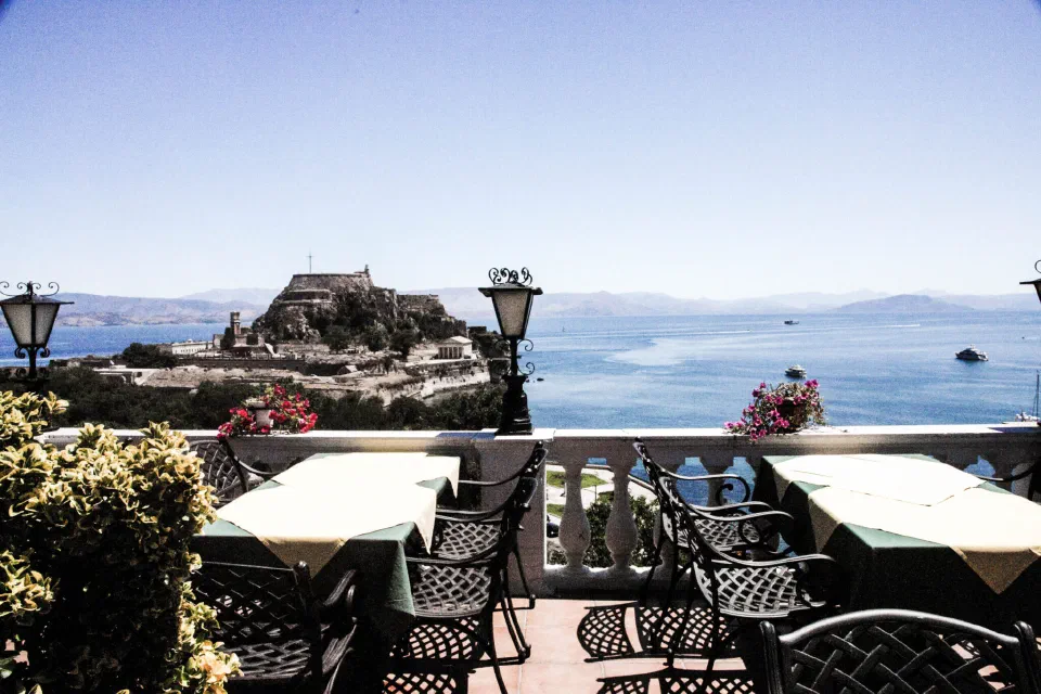 The rooftop terrace at Cavalieri Hotel overlooking Corfu Town and the sea.