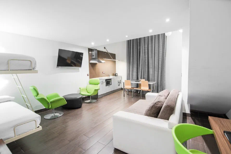 Living and dining space with a kitchenette in an Apartment at Petit Palace Boqueria Garden.
