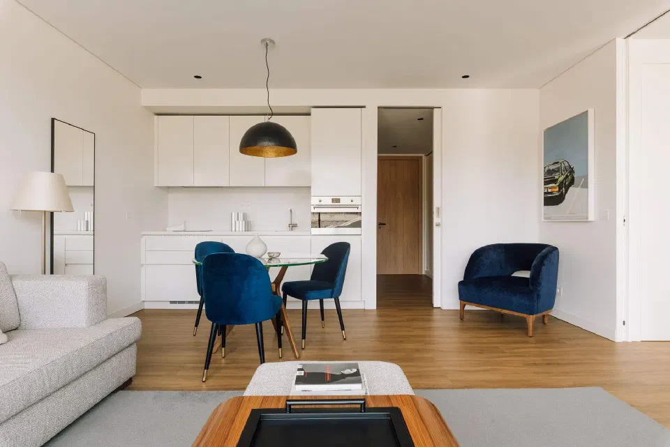 Apartment living and dining space with a kitchen at Martinhal Lisbon Oriente.