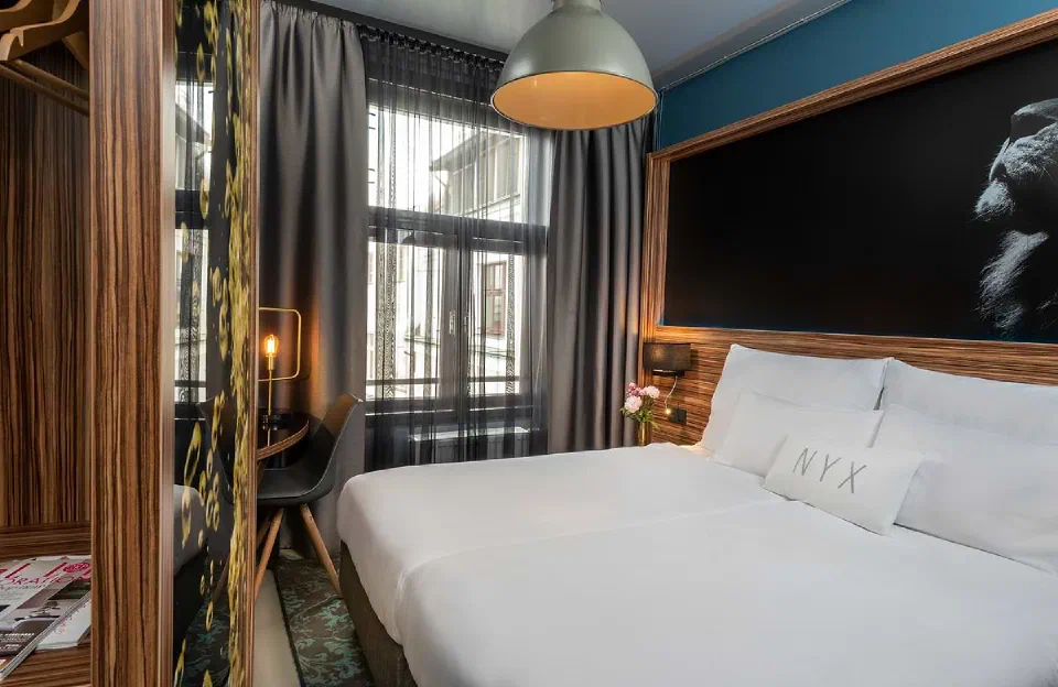 Little Star room at NYX Hotel Prague with a double bed and oversized wall art.