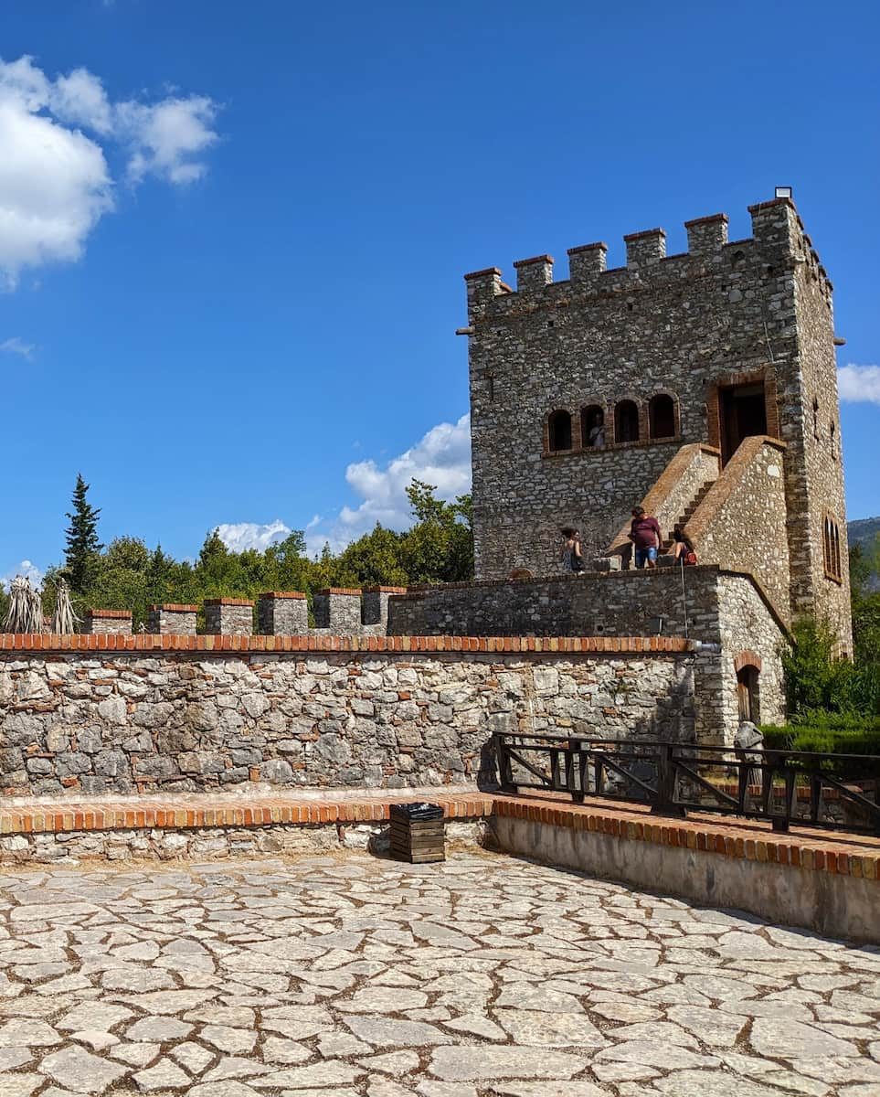 The Venetian tower and stone-paved courtyard at Butrint archaeological park.