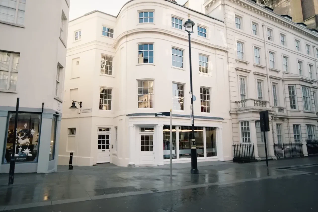 Avery Row and Lancashire Court street sign on a Mayfair shopfront