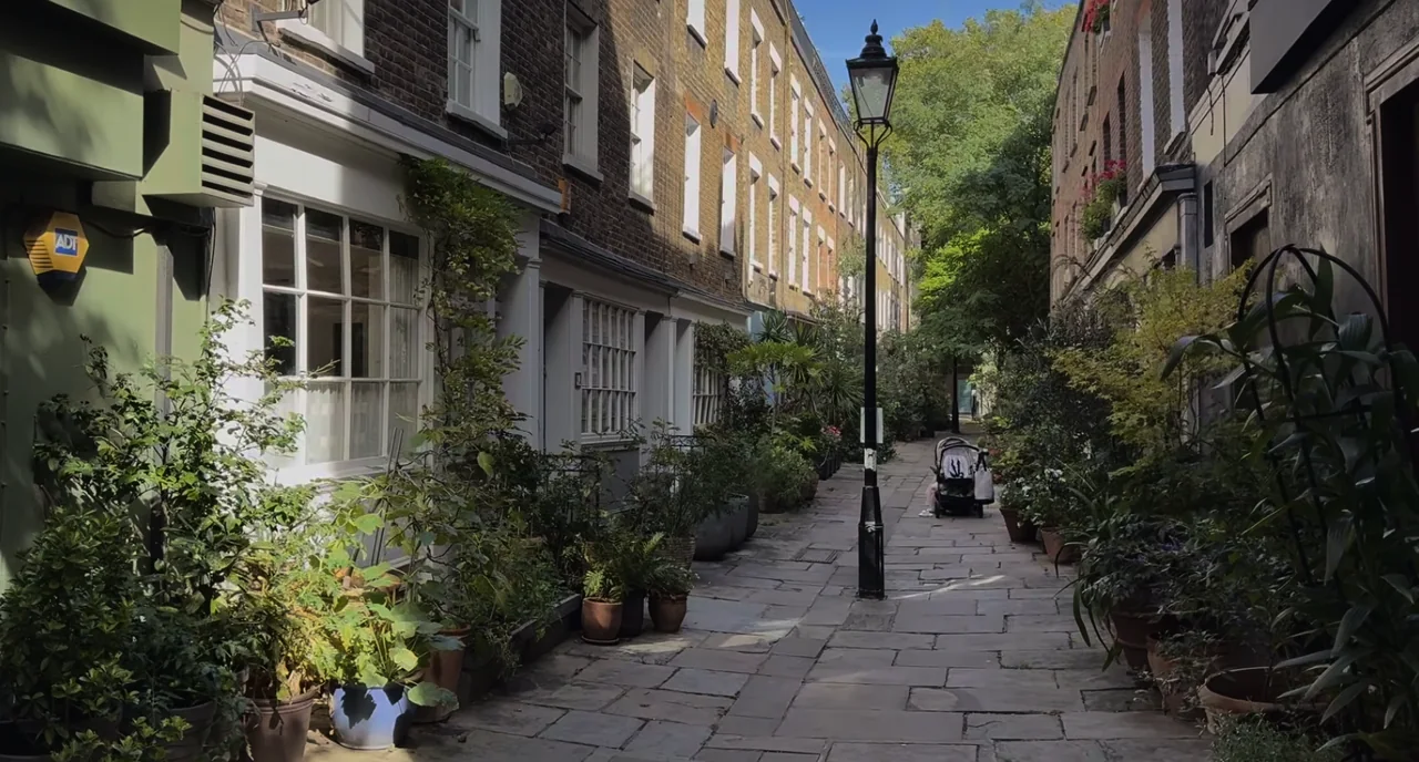 Greenery and a lamppost along pedestrian Colville Place off Charlotte Street in Fitzrovia