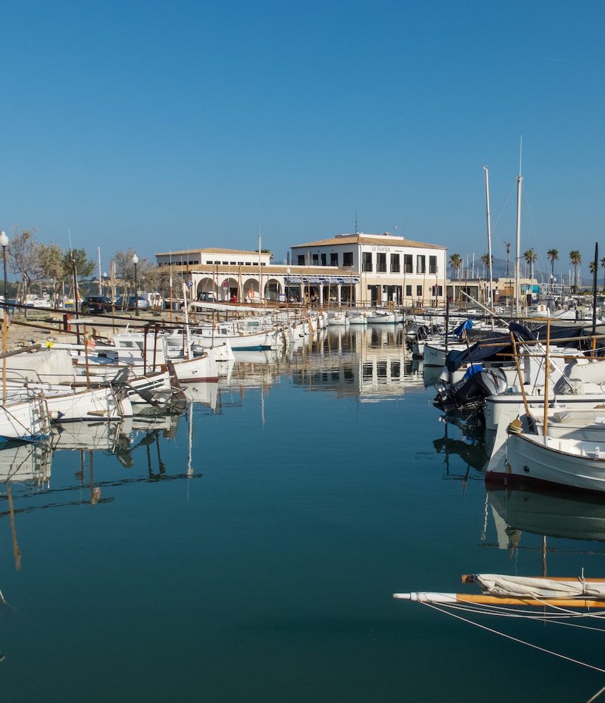 Boats and their reflections in Port de Pollença’s harbour.