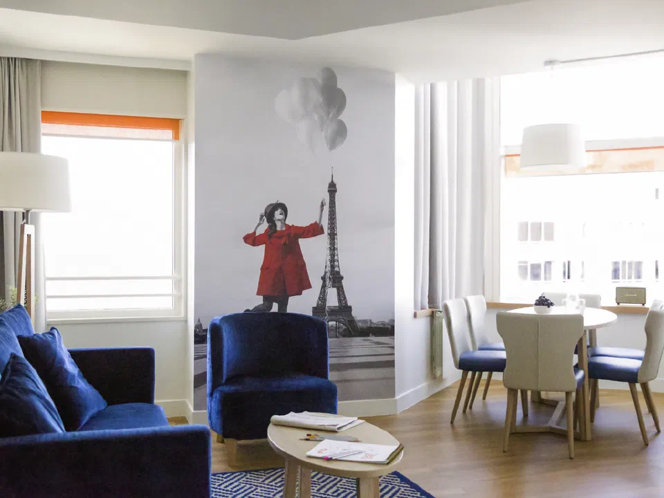Lounge and dining area in a six-person apartment at Adagio Paris Centre Tour Eiffel.