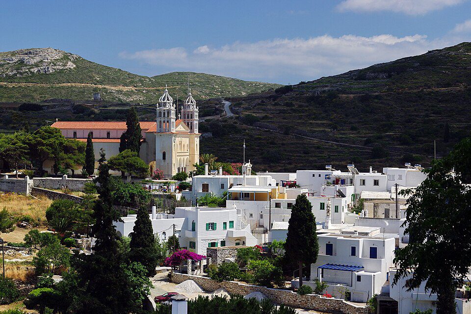 Lefkes village and its twin-spired church against the hills of Paros