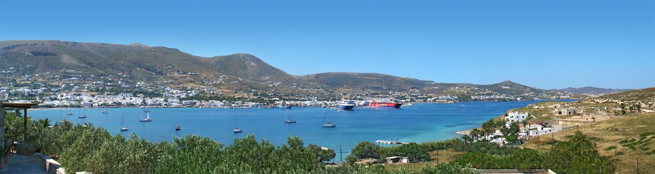 Parikia bay with sailing boats and the town along the waterfront