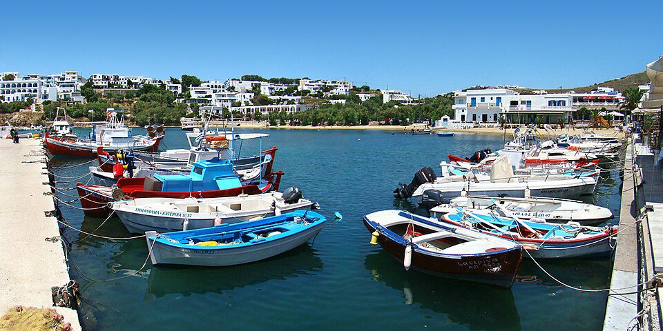 Fishing boats in Piso Livadi harbour in front of the village