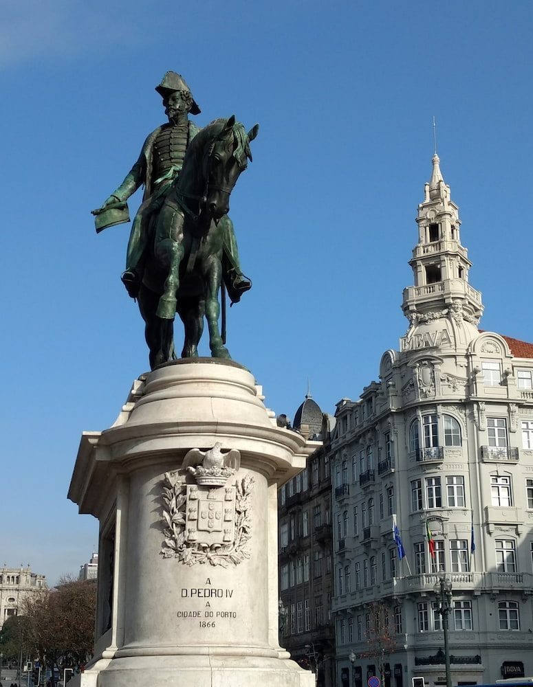 The equestrian statue of Dom Pedro IV beside the ornate buildings around Aliados.
