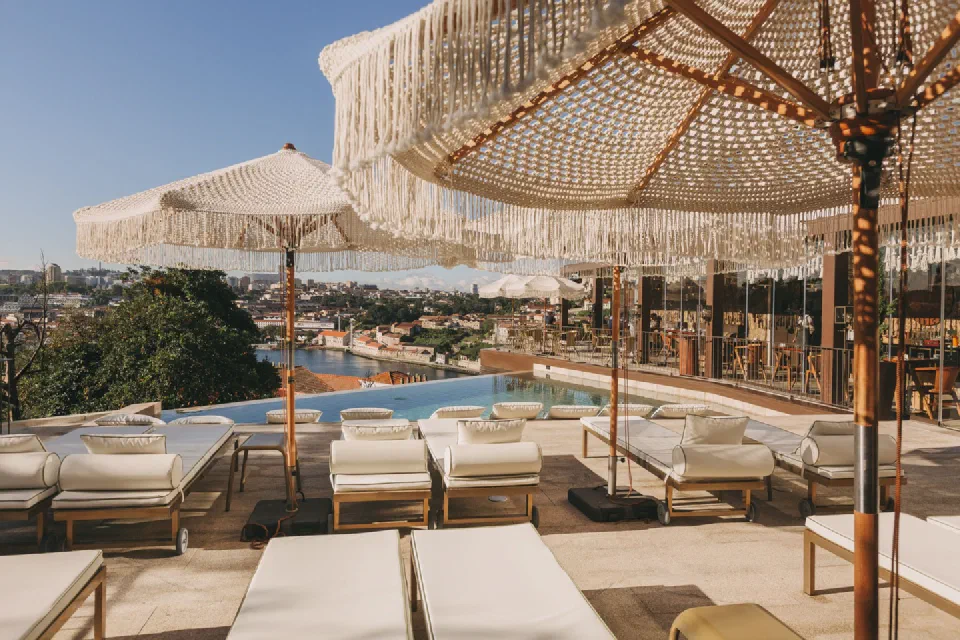 Poolside loungers and parasols on Torel Avantgarde’s terrace, with the Douro below.