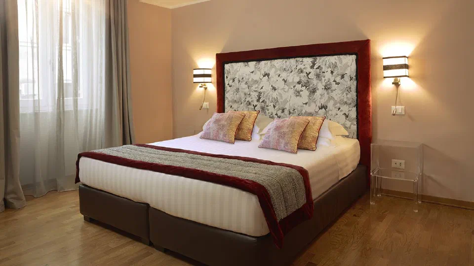The master bedroom in a Two Bedroom Apartment at Trianon Borgo Pio.