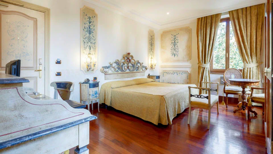 A decorated double room at Hotel Villa San Pio.