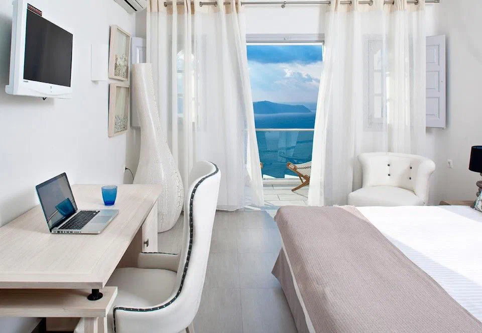 Superior Double bedroom with balcony doors at Belvedere Suites in Firostefani.