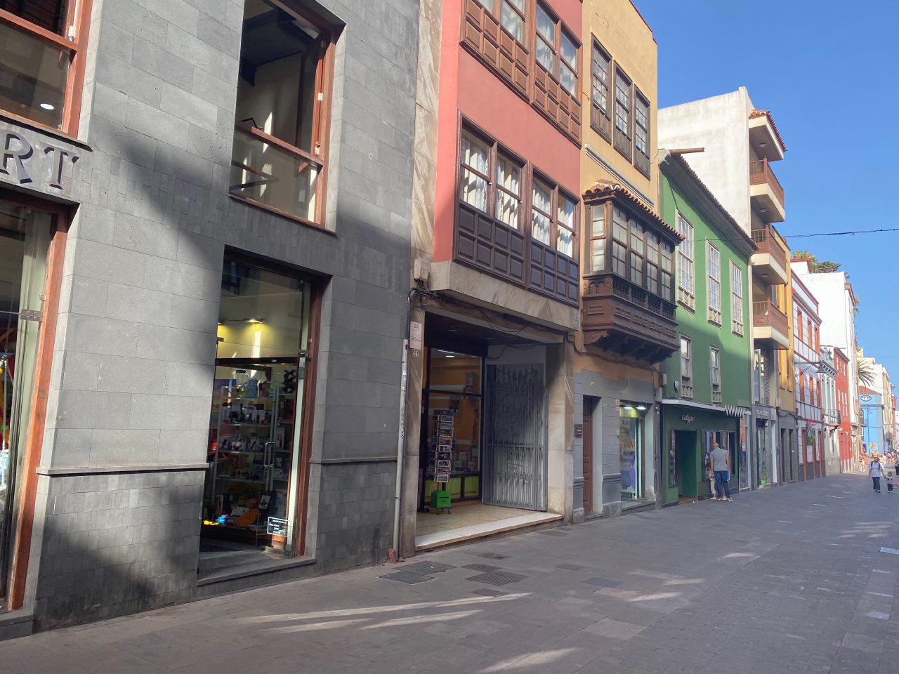 Colourful façades and wooden balconies along Calle Obispo Rey Redondo in La Laguna.