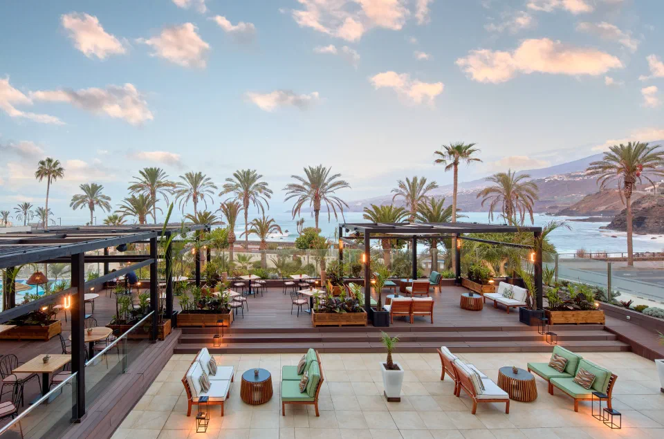 Outdoor lounge terrace overlooking the promenade and Atlantic at Meliá Costa Atlantis.