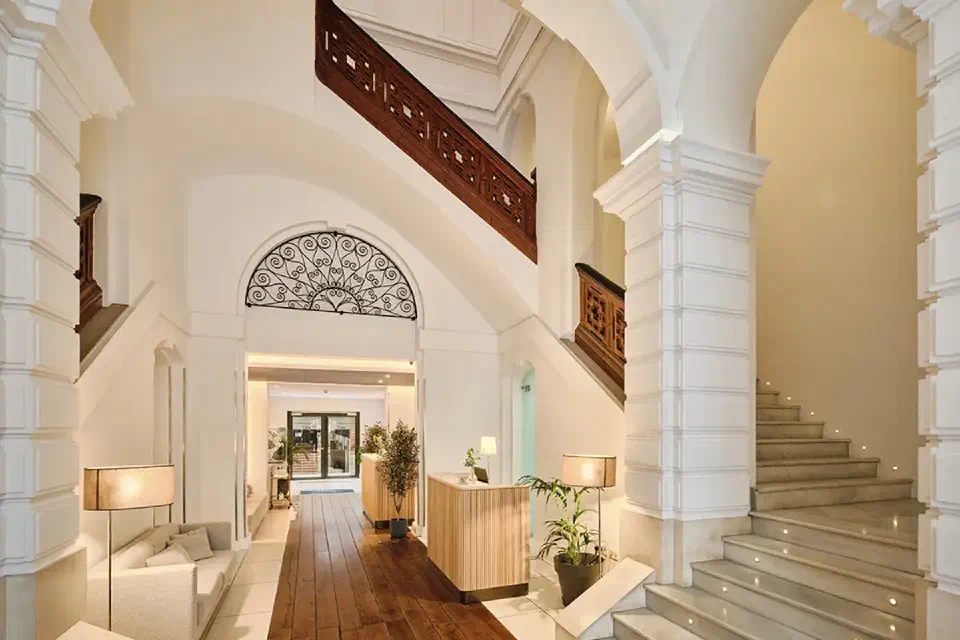 The vaulted palace hall and staircase at Hospes Palau de la Mar.