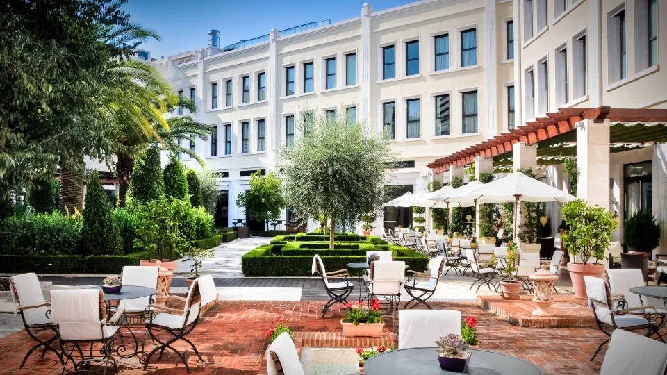 Tables, trees and planted courtyards at The Westin Valencia.