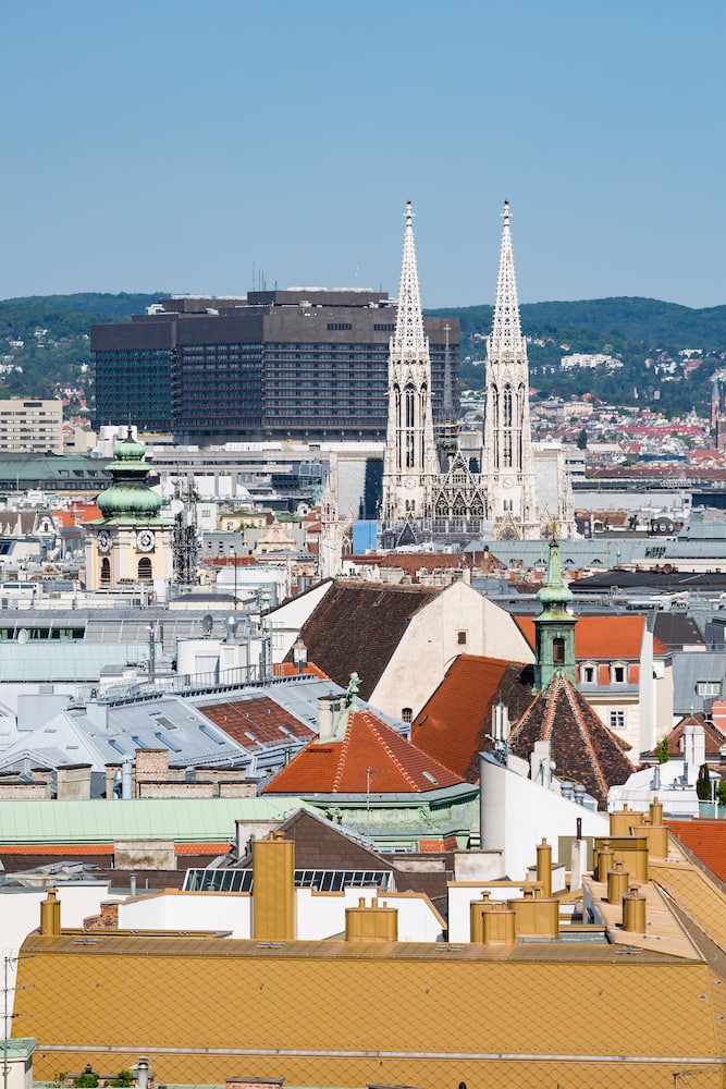 The twin spires of Votive Church above Vienna rooftops towards Alsergrund
