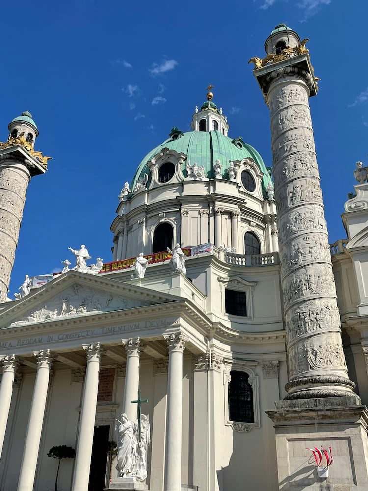 Karlskirche's green dome and decorated columns, Karlsplatz's Baroque monument in Wieden