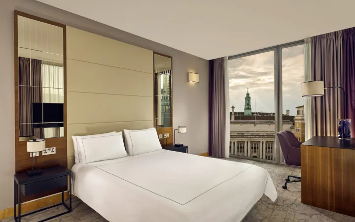 Double Superior room at Park Plaza County Hall London, with a king bed and a large window